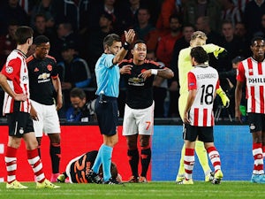 Half-Time Report: PSV, Man Utd level as Shaw stretchered off
