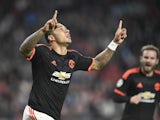 Manchester's Dutch forward Memphis Depay celebrates after scoring the opening goal during the UEFA Champions League Group B football match between PSV Eindhoven and Manchester United at the Philips stadium in Eindhoven, the Netherlands, on September 15, 2