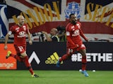 Lyon's French forward Alexandre Lacazette (R) celebrates after scoring a goal during the French L1 football match Marseille (OM) vs Lyon (OL) on September 20, 2015 at Velodrome Stadium in Marseille, southern France.
