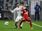 Marseille's Dutch defender Karim Rekik (L) vies with Lyon's French forward Claudio Beauvue during the French L1 football match Marseille (OM) vs Lyon (OL) on September 20, 2015 at Velodrome Stadium in Marseille, southern France. 