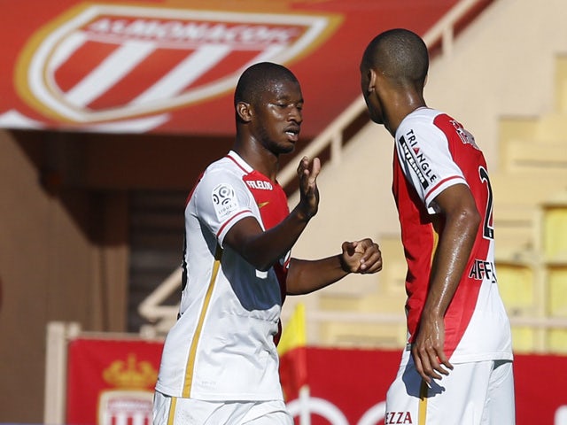 Monaco's Malian defender Almamy Toure (L) celebrates with a teammate after scoring a goal during the French L1 football match Monaco (ASM) vs Lorient (FCL) on September 20, 2015