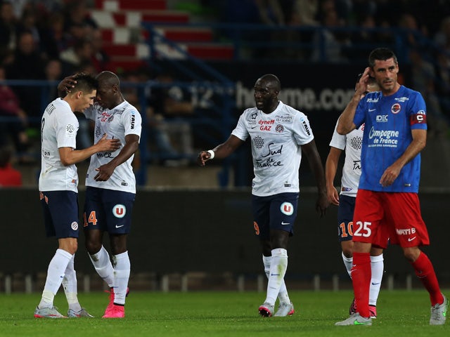 Montpellier's French midfielder Jonas Martin (L) celebrates after scoring during the French L1 football match between Stade Malherbe de Caen (SMC) and Montpellier (MHSC) on September 17, 2015