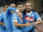 Napoli's Argentinian-French forward Gonzalo Higuain (R) celebrates with teammates after scoring during the Italian Serie A football match SSC Napoli vs SS Lazio on September 20, 2015 at the San Paolo stadium in Naples.