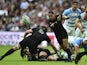 New Zealand's scrum half Aaron Smith passes the ball during a Pool C match of the 2015 Rugby World Cup between New Zealand and Argentina at Wembley stadium, north London on September 20, 2015