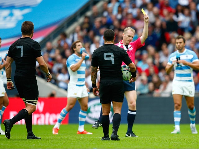 Referee Wayne Barnes shows Richie McCaw of the New Zealand All Blacks a yellow card during the 2015 Rugby World Cup Pool C match between New Zealand and Argentina at Wembley Stadium on September 20, 2015