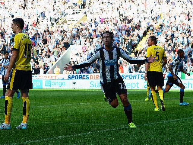 Daryl Janmaat of Newcastle United celebrates scoring his team's first goal during the Barclays Premier League match between Newcastle United and Watford at St James' Park on September 19, 2015 in Newcastle upon Tyne, United Kingdom.
