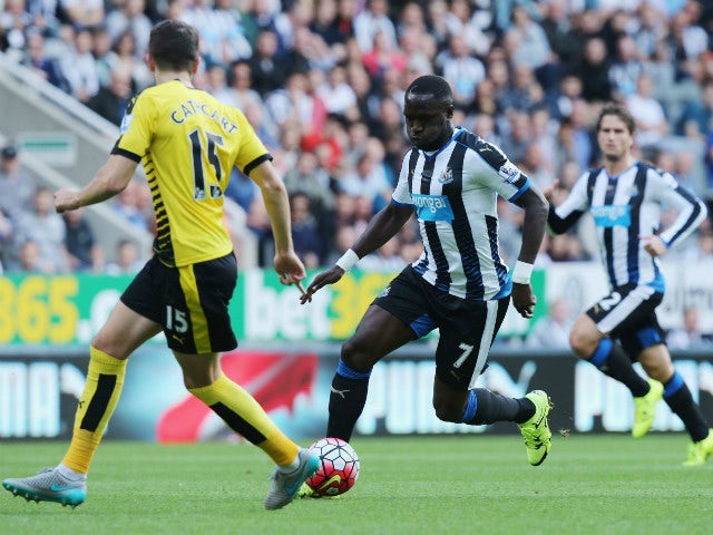 Moussa Sissoko of Newcastle United and Craig Cathcart of Watford compete for the ball during the Barclays Premier League match between Newcastle United and Watford at St James' Park on September 19, 2015 in Newcastle upon Tyne, United Kingdom.