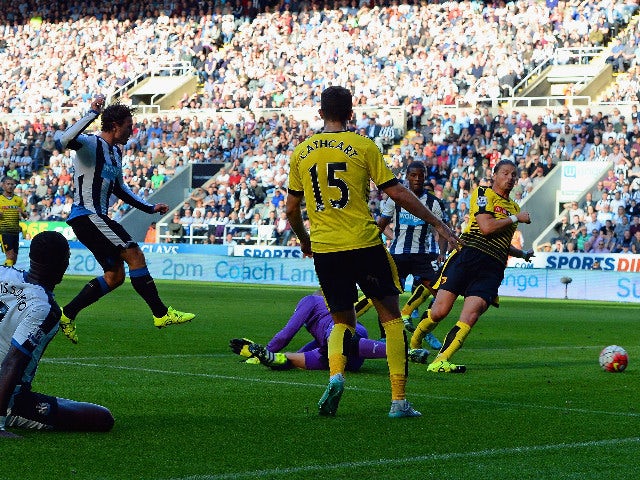 Daryl Janmaat (3rd L) of Newcastle United scores his team's first goal during the Barclays Premier League match between Newcastle United and Watford at St James' Park on September 19, 2015 in Newcastle upon Tyne, United Kingdom