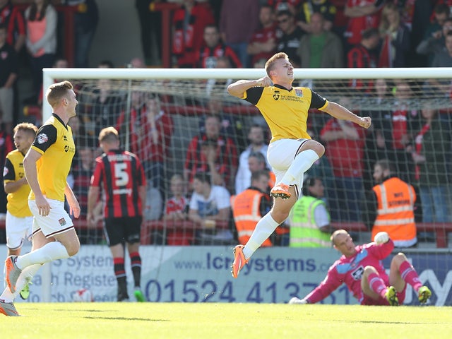 Sam Hoskins of Northampton Town celebrates after scoring his sides 2nd goal during the Sky Bet League Two match between Morecambe and Northampton Town at Globe Arena on September 19, 2015