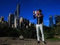 US Open champion Novak Djokovic poses with the trophy in New York