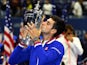 Novak Djokovic kisses the trophy after beating Roger Federer to win the 2015 US Open on September 13, 2015