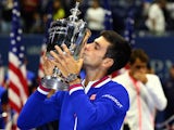 Novak Djokovic kisses the trophy after beating Roger Federer to win the 2015 US Open on September 13, 2015