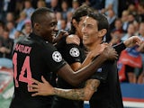 Paris Saint-Germain's Argentinian forward Angel Di Maria (R) celebrates with teammates after scoring a goal during the UEFA Champions League group A football match between Paris Saint Germain (PSG) and Malmo FF on September 15, 2015