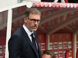 Paris Saint-Germain's French head coach Laurent Blanc looks on during the French Ligue 1 football match between Reims and Paris Saint-Germain on September 19, 2015