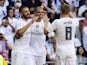 Real Madrid's French forward Karim Benzema (L) celebrates with Real Madrid's Portuguese defender Pepe (C) and Real Madrid's German midfielder Toni Kroos after scoring a goal during the Spanish league football match Real Madrid CF vs Granada FC at the Sant