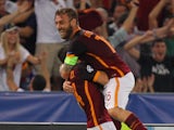 Alessandro Florenzi (L) with his teammate Daniele De Rossi of AS Roma celebrates after scoring the team's first goal during the UEFA Champions League Group E match between AS Roma and FC Barcelona at Stadio Olimpico on September 16, 2015