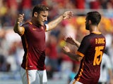 Francesco Totti with his teammate Miralem Pjanic of AS Roma celebrates after scoring their first goal during the Serie A match between AS Roma and US Sassuolo Calcio at Stadio Olimpico on September 20, 2015