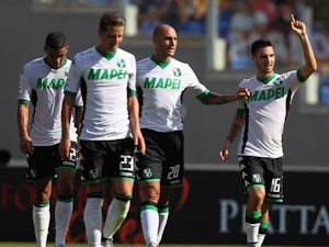 Matteo Politano (R) celebrates with his teammates of US Sassuolo after scoring the team's second goal during the Serie A match between AS Roma and US Sassuolo Calcio at Stadio Olimpico on September 20, 2015 