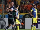 Schalke 04's Johannes Geis (L) and Klaas-Jan Huntelaar celebrate after scoring a goal during the UEFA Europa League football match between APOEL and Schalke 04 at the GSP Stadium in the Cypriot capital Nicosia on September 17, 2015