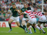 Zane Kirchner of South Africa takes on Kensuke Hatakeyama of Japan during the 2015 Rugby World Cup Pool B match between South Africa and Japan at the Brighton Community Stadium on September 19, 2015 in Brighton, United Kingdom.