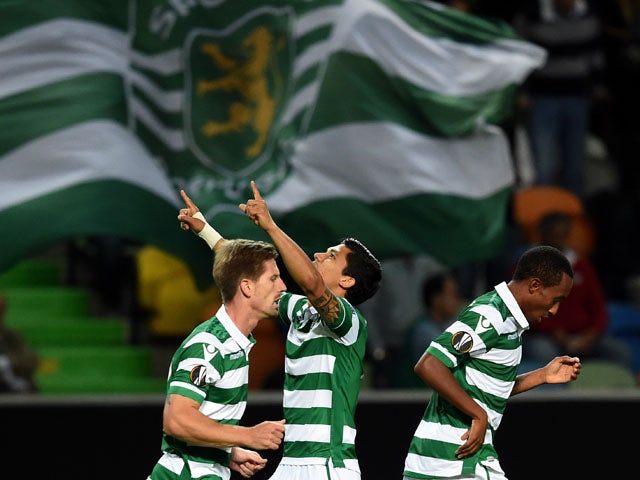 Sporting's Colombian forward Fredy Montero (C) celebrates after scoring the equalizer goal during the UEFA Europa League group H football match Sporting CP vs Lokomotiv Moskva at the Jose Alvalade stadium in Lisbon on September 17, 2015