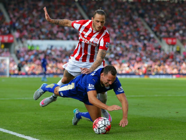 Danny Drinkwater of Leicester City is fouled by Marko Arnautovic of Stoke City in the penalty area during the Barclays Premier League match between Stoke City and Leicester City at Britannia Stadium on September 19, 2015 in Stoke on Trent, United Kingdom.