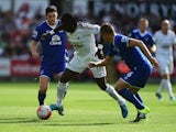 Bafetimbi Gomis of Swansea City and Phil Jagielka of Everton compete for the ball during the Barclays Premier League match between Swansea City and Everton at the Liberty Stadium on September 19, 2015 in Swansea, United Kingdom.