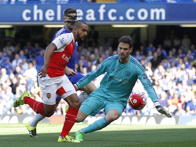 Arsenal's Theo Walcott tries to slip one past Chelsea keeper Asmir Begovic on September 19, 2015