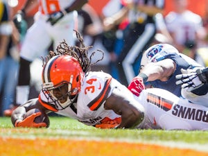 Running back Isaiah Crowell #34 of the Cleveland Browns scores a touchdown against the Tennessee Titans during the first quarter at FirstEnergy Stadium on September 20, 2015 in Cleveland, Ohio.