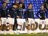 Andros Townsend of Tottenham Hotspur (C) looks on as the players warm up prior to the UEFA Europa League Group J match between Tottenham Hotspur FC and Qarabag FK at White Hart Lane on September 17, 2015 in London, United Kingdom.