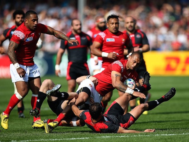 Tonga's Viliami Helu is tackled during the Rugby World Cup match with Georgia on September 19, 2015
