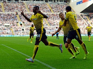 Odion Ighalo of Watford celebrates scoring his team's first goal with his team mates during the Barclays Premier League match between Newcastle United and Watford at St James' Park on September 19, 2015 in Newcastle upon Tyne, United Kingdom.