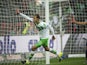 Wolfsburg's forward Bas Dost of the Netherlands celebrates scoring the opening goal during the German first division Bundesliga football match VfL Wolfsburg vs Hertha BSC Berlin, in Wolfsburg, northern Germany on September 19, 2015