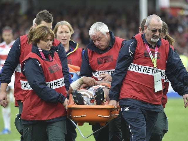 Japan's Amanaki Mafi is stretchered off during the Rugby World Cup game with Scotland on September 23, 2015