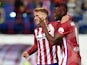 Atletico Madrid's French forward Antoine Griezmann (L) and Atletico Madrid's Colombian forward Jackson Martinez celebrate after scoring a goal during the Spanish league football match Club Atletico de Madrid vs Getafe CF at the Vicente Calderon stadium in