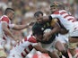South Africa's hooker Bismarck du Plessis (C) is takcled during a Pool B match of the 2015 Rugby World Cup between South Africa and Japan at the Brighton community stadium in Brighton, south east England on September 19, 2015.