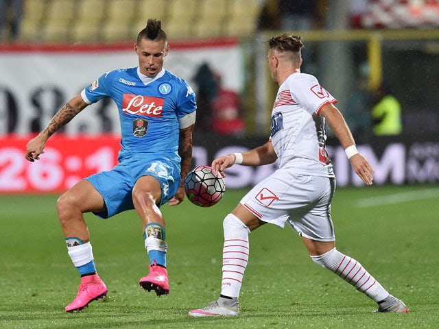 Gaetano Letizia of Carpi and Marek Hamsik of Napoli in action during the Serie A match between Carpi FC and SSC Napoli at Alberto Braglia Stadium on September 23, 2015