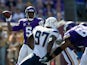 Teddy Bridgewater #5 of the Minnesota Vikings looks to pass the ball under pressure from Jeremiah Attaochu #97 of the San Diego Chargers during the first quarter of the game on September 27, 2015 at TCF Bank Stadium in Minneapolis, Minnesota.