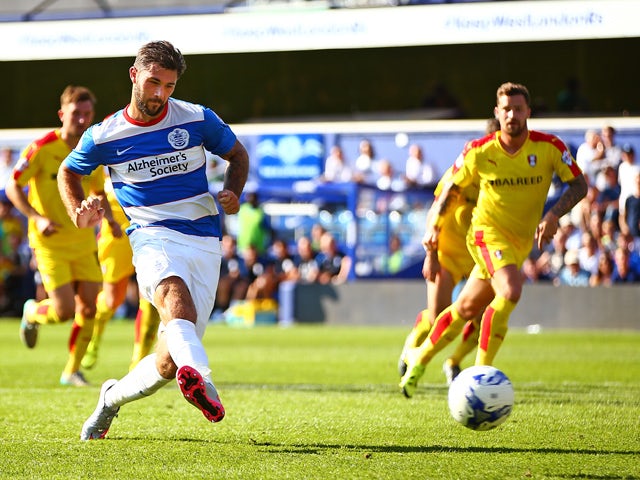 Charlie Austin of QPR scores his sides fourth goal from the penalty spot during the Sky Bet Championship match between Queens Park Rangers and Rotherham United at Loftus Road on August 22, 2015