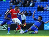Jordan Cousins of Charlton Athletic is tackled by Fabio of Cardiff City during the Sky Bet Championship match between Cardiff City and Charlton Athletic at the Cardiff City Stadium on September 26, 2015