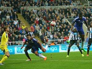 Chelsea's Brazilian midfielder Ramires (C) tries to head Willian's freekick which goes on to beat Newcastle United's Dutch goalkeeper Tim Krul (L) for Chelsea's second goal during the English Premier League football match between Newcastle United and Chel