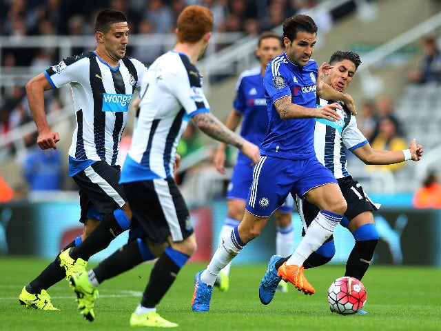 Chelseas Spanish midfielder Cesc Fabregas (2nd R) runs with the ball during the English Premier League football match between Newcastle United and Chelsea at St James' Park in Newcastle-upon-Tyne, north east England, on September 26, 2015. 