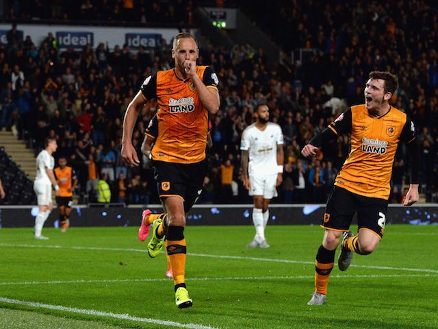 David Meyler of Hull City celebrates scoring the opening goal with Andrew Robertson of Hull City during the Capital One Cup third round match between Hull City and Swansea City at KC Stadium on September 22, 2015 in Hull, England.