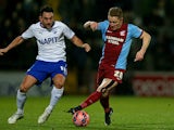 Gary McSheffrey of Scunthorpe is challenged by Gary Roberts of Chesterfield during the FA Cup Third Round match between Scunthorpe United and Chesterfield FC at Glanford Park on January 6, 2015 in Scunthorpe, England.