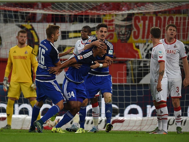 Ingolstadt's defender Marvin Matip and his teammates celebrate scoring during the German first division Bundesliga football match FC Cologne vs FC Ingolstadt 04 in Cologne, western Germany on September 25, 2015
