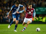 Jack Grealish of Aston Villa holds off Stephen Gleeson of Birmingham City during the Capital One Cup third round match between Aston Villa and Birmingham City at Villa Park on September 22, 2015 in Birmingham, England. 
