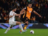 Jordi Amat of Swansea City tackles Jake Livermore of Hull City during the Capital One Cup third round match between Hull City and Swansea City at KC Stadium on September 22, 2015 in Hull, England.