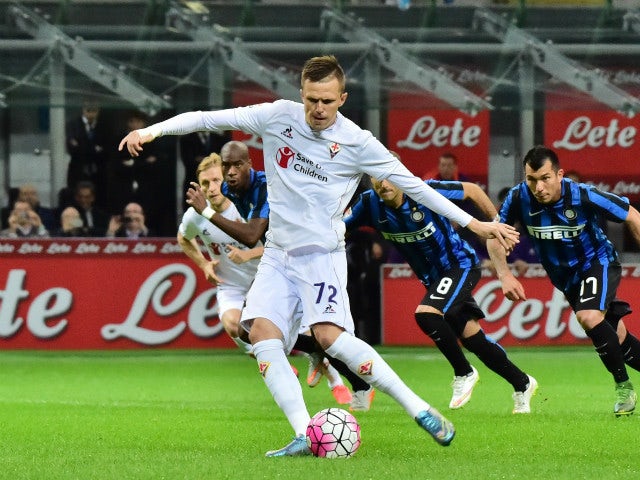 Fiorentina's Slovenian midfielder Josip Ilicic kicks and scores a penalty during the Serie A football match between Inter Milan and Fiorentina at the San Siro Stadium in Milan on September 27, 2015.