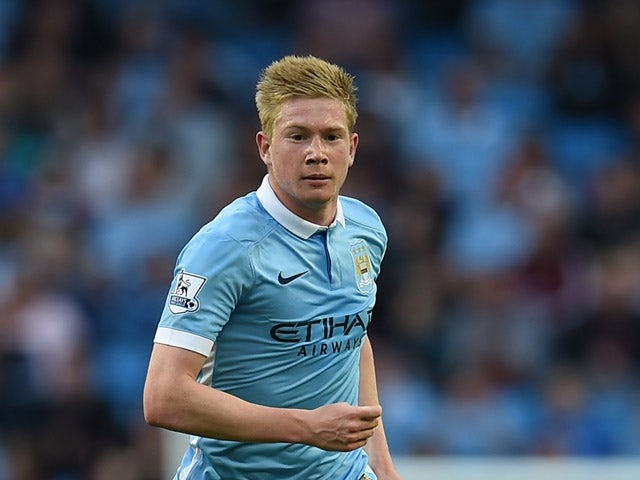 Manchester City's Belgian midfielder Kevin De Bruyne runs with the ball during the English Premier League football match between Manchester City and West Ham United at The Etihad Stadium in Manchester, north west England on September 19, 2015