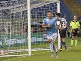 Lazio's forward from Serbia Filip Djordjevic celebrates after scoring a goal during the Italian Serie A football match Lazio vs Genoa on September 23, 201